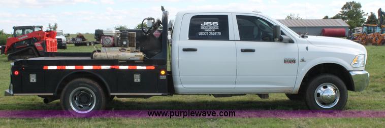 image for item K8911 2012 Dodge Ram 3500HD Quad Cab flatbed pickup truck