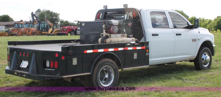 image for item K8911 2012 Dodge Ram 3500HD Quad Cab flatbed pickup truck