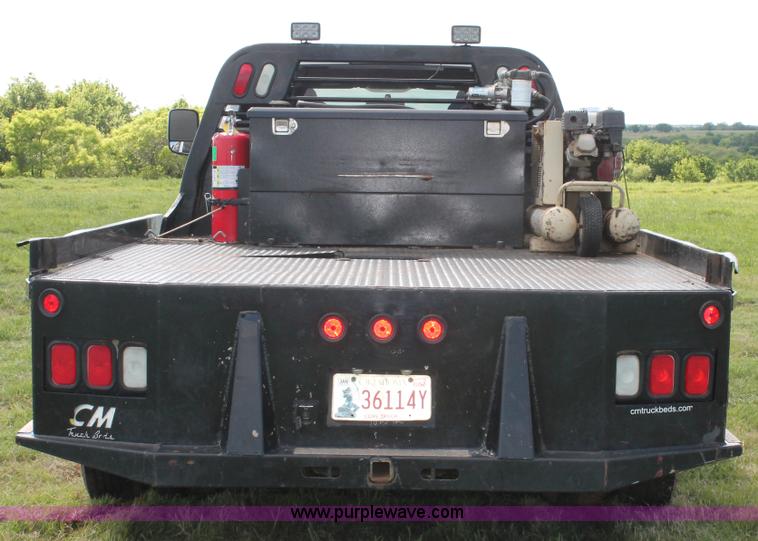 image for item K8911 2012 Dodge Ram 3500HD Quad Cab flatbed pickup truck
