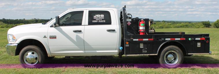 image for item K8911 2012 Dodge Ram 3500HD Quad Cab flatbed pickup truck