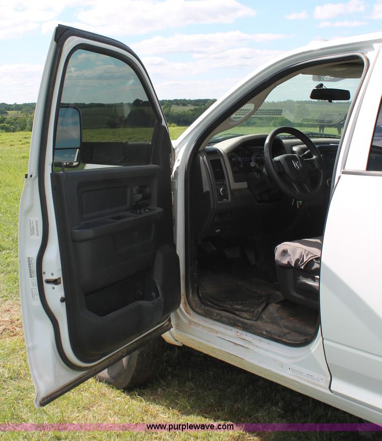 image for item K8911 2012 Dodge Ram 3500HD Quad Cab flatbed pickup truck