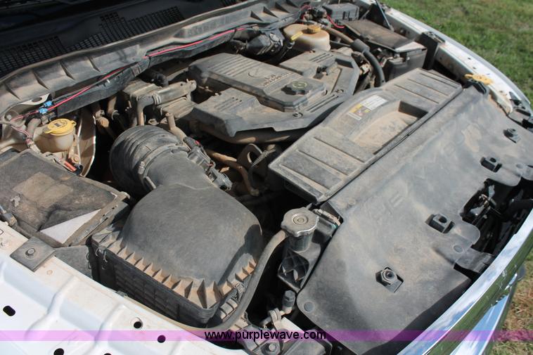 image for item K8911 2012 Dodge Ram 3500HD Quad Cab flatbed pickup truck