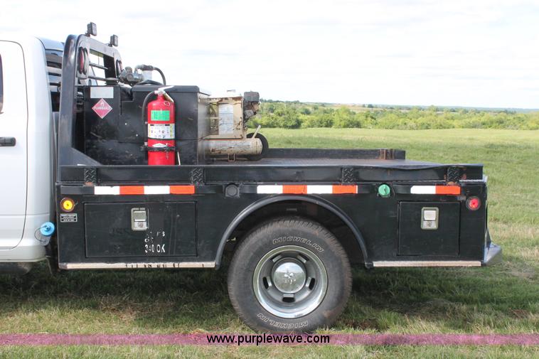 image for item K8911 2012 Dodge Ram 3500HD Quad Cab flatbed pickup truck