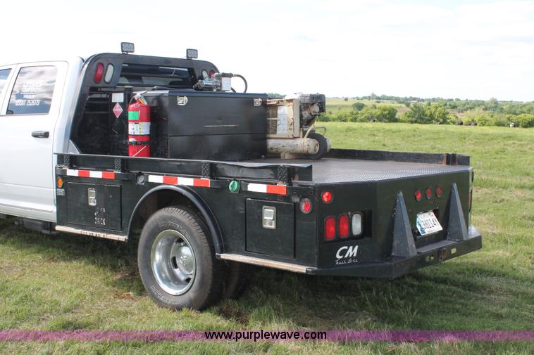 image for item K8911 2012 Dodge Ram 3500HD Quad Cab flatbed pickup truck