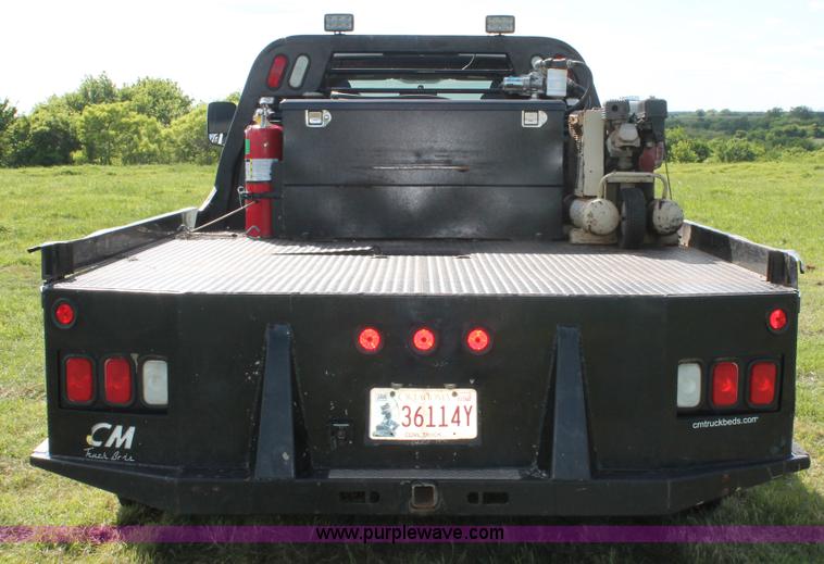 image for item K8911 2012 Dodge Ram 3500HD Quad Cab flatbed pickup truck