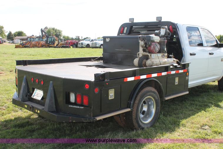 image for item K8911 2012 Dodge Ram 3500HD Quad Cab flatbed pickup truck