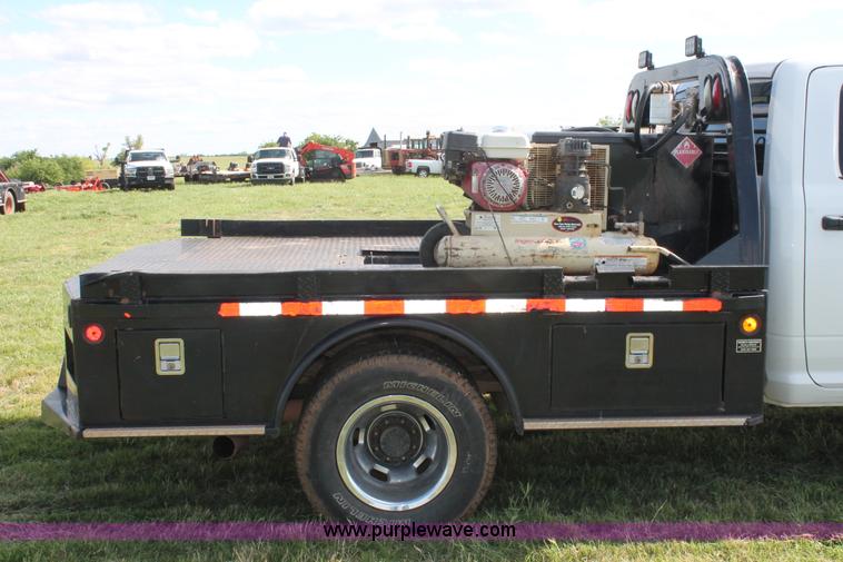 image for item K8911 2012 Dodge Ram 3500HD Quad Cab flatbed pickup truck