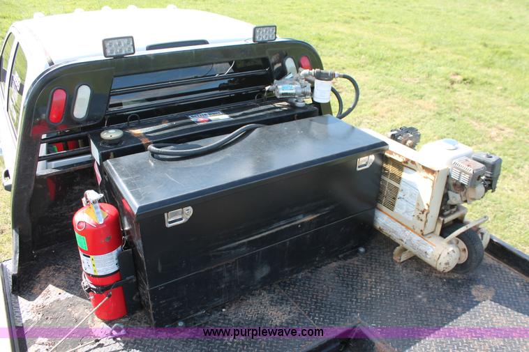 image for item K8911 2012 Dodge Ram 3500HD Quad Cab flatbed pickup truck