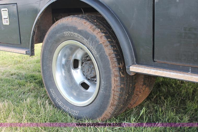 image for item K8911 2012 Dodge Ram 3500HD Quad Cab flatbed pickup truck