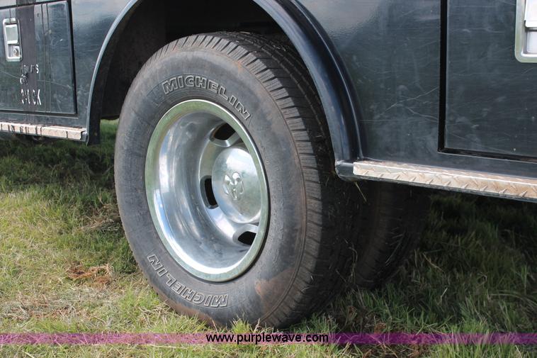 image for item K8911 2012 Dodge Ram 3500HD Quad Cab flatbed pickup truck