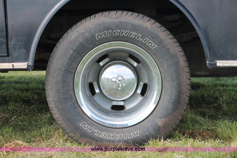 image for item K8911 2012 Dodge Ram 3500HD Quad Cab flatbed pickup truck