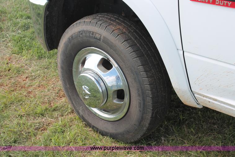 image for item K8911 2012 Dodge Ram 3500HD Quad Cab flatbed pickup truck