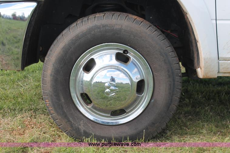 image for item K8911 2012 Dodge Ram 3500HD Quad Cab flatbed pickup truck