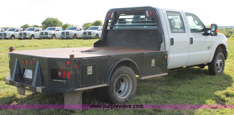 image for item K8912 2012 Ford F350  XL Super Duty Crew Cab flatbed pickup truck