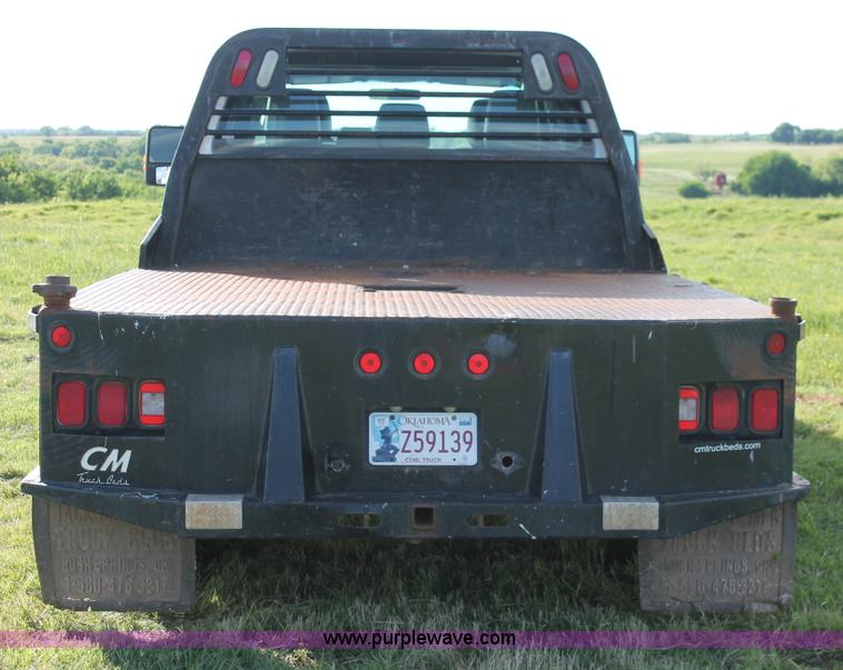 image for item K8912 2012 Ford F350  XL Super Duty Crew Cab flatbed pickup truck