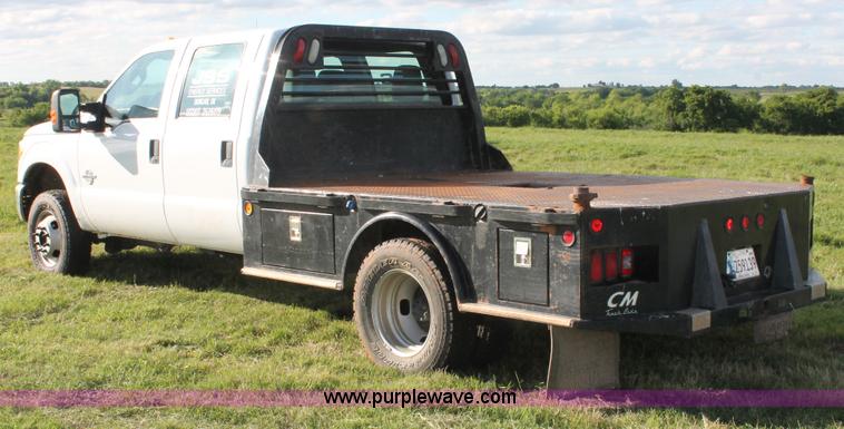 image for item K8912 2012 Ford F350  XL Super Duty Crew Cab flatbed pickup truck