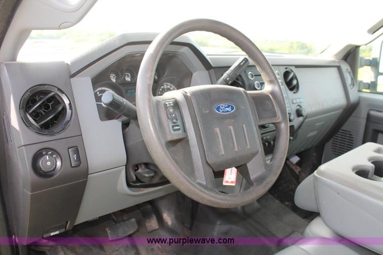 image for item K8912 2012 Ford F350  XL Super Duty Crew Cab flatbed pickup truck