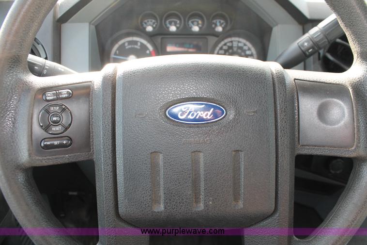 image for item K8912 2012 Ford F350  XL Super Duty Crew Cab flatbed pickup truck