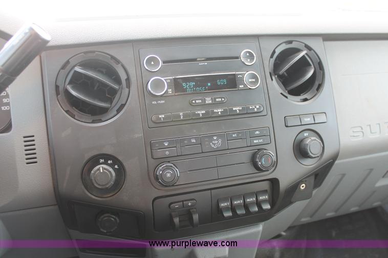 image for item K8912 2012 Ford F350  XL Super Duty Crew Cab flatbed pickup truck