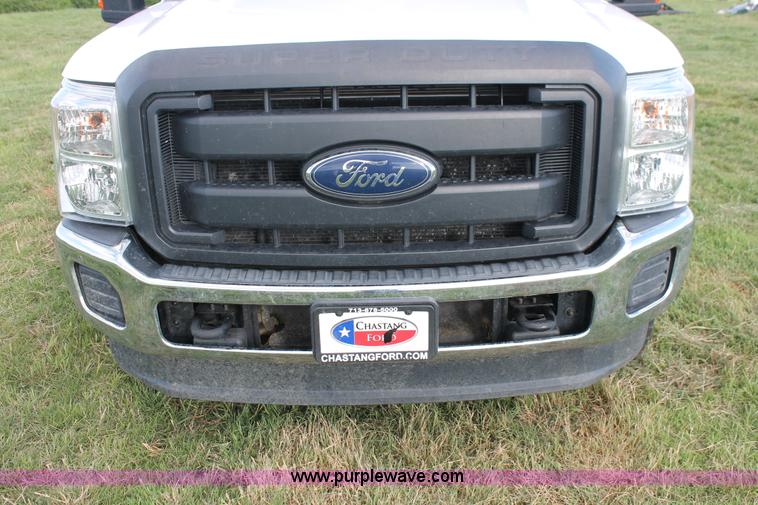 image for item K8912 2012 Ford F350  XL Super Duty Crew Cab flatbed pickup truck