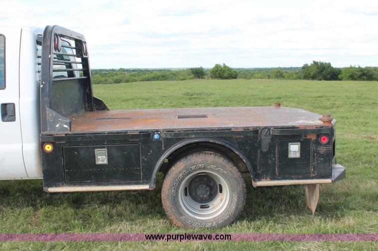 image for item K8912 2012 Ford F350  XL Super Duty Crew Cab flatbed pickup truck