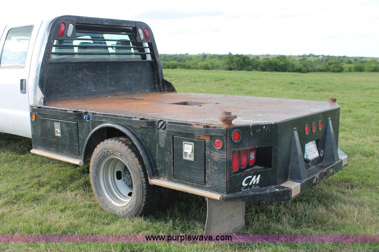 image for item K8912 2012 Ford F350  XL Super Duty Crew Cab flatbed pickup truck