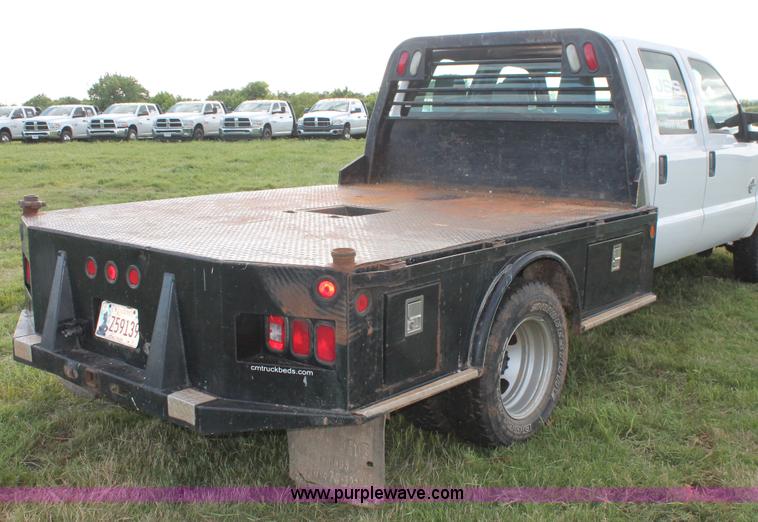 image for item K8912 2012 Ford F350  XL Super Duty Crew Cab flatbed pickup truck