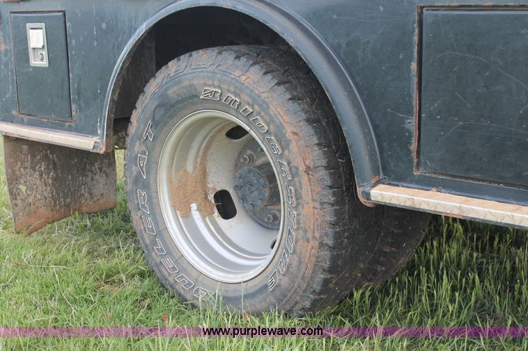 image for item K8912 2012 Ford F350  XL Super Duty Crew Cab flatbed pickup truck