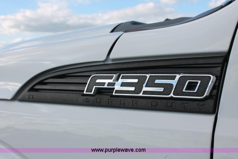 image for item K8912 2012 Ford F350  XL Super Duty Crew Cab flatbed pickup truck