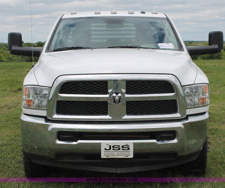 image for item K8913 2014 Dodge Ram 3500HD Quad Cab flatbed pickup truck