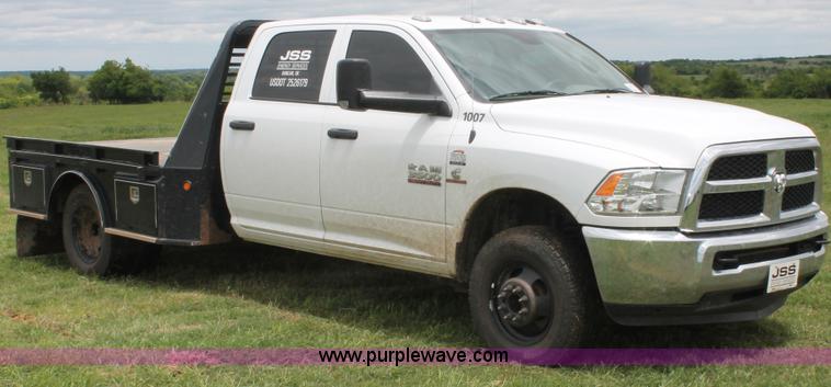 image for item K8913 2014 Dodge Ram 3500HD Quad Cab flatbed pickup truck