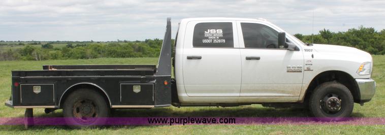 image for item K8913 2014 Dodge Ram 3500HD Quad Cab flatbed pickup truck