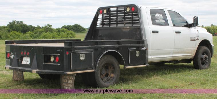 image for item K8913 2014 Dodge Ram 3500HD Quad Cab flatbed pickup truck