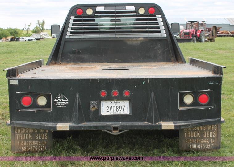 image for item K8913 2014 Dodge Ram 3500HD Quad Cab flatbed pickup truck