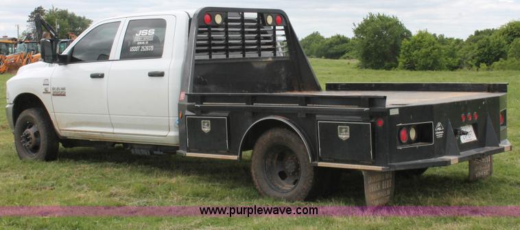 image for item K8913 2014 Dodge Ram 3500HD Quad Cab flatbed pickup truck