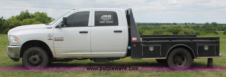 image for item K8913 2014 Dodge Ram 3500HD Quad Cab flatbed pickup truck
