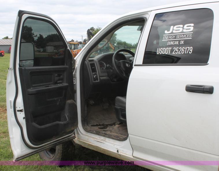 image for item K8913 2014 Dodge Ram 3500HD Quad Cab flatbed pickup truck