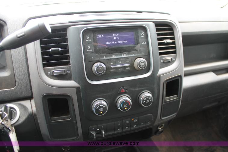 image for item K8913 2014 Dodge Ram 3500HD Quad Cab flatbed pickup truck