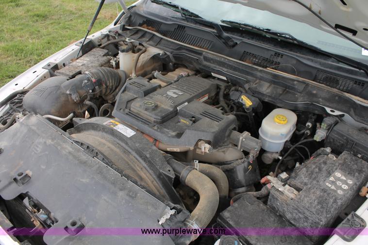 image for item K8913 2014 Dodge Ram 3500HD Quad Cab flatbed pickup truck