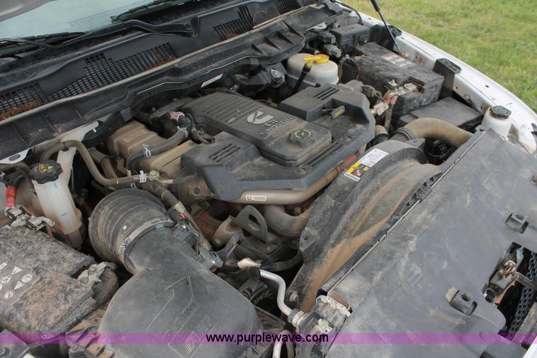 image for item K8913 2014 Dodge Ram 3500HD Quad Cab flatbed pickup truck