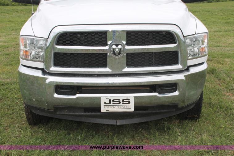 image for item K8913 2014 Dodge Ram 3500HD Quad Cab flatbed pickup truck