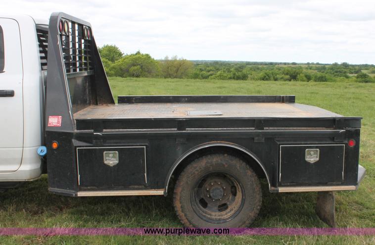 image for item K8913 2014 Dodge Ram 3500HD Quad Cab flatbed pickup truck