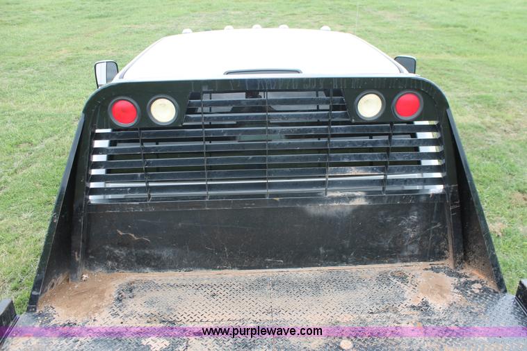 image for item K8913 2014 Dodge Ram 3500HD Quad Cab flatbed pickup truck