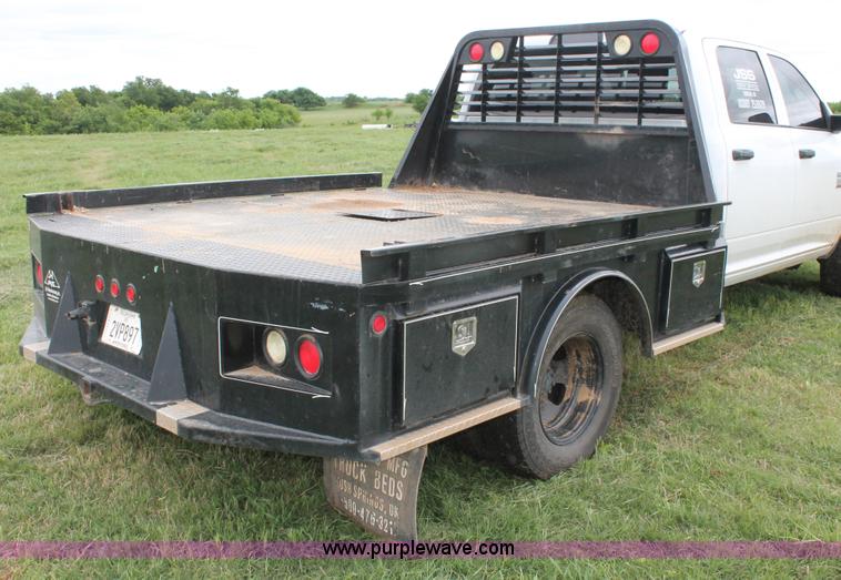 image for item K8913 2014 Dodge Ram 3500HD Quad Cab flatbed pickup truck