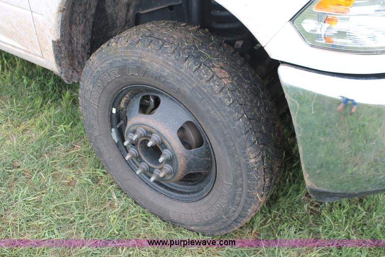 image for item K8913 2014 Dodge Ram 3500HD Quad Cab flatbed pickup truck