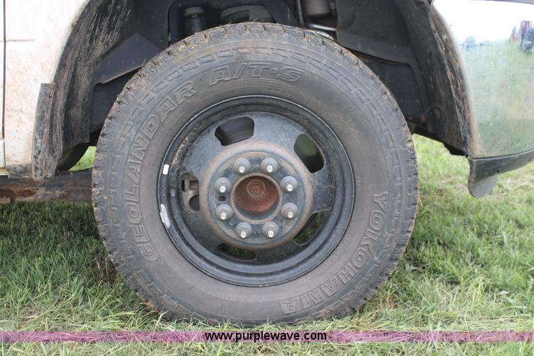 image for item K8913 2014 Dodge Ram 3500HD Quad Cab flatbed pickup truck