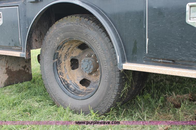 image for item K8913 2014 Dodge Ram 3500HD Quad Cab flatbed pickup truck