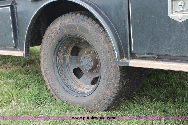 image for item K8913 2014 Dodge Ram 3500HD Quad Cab flatbed pickup truck