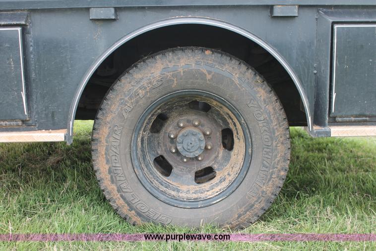 image for item K8913 2014 Dodge Ram 3500HD Quad Cab flatbed pickup truck