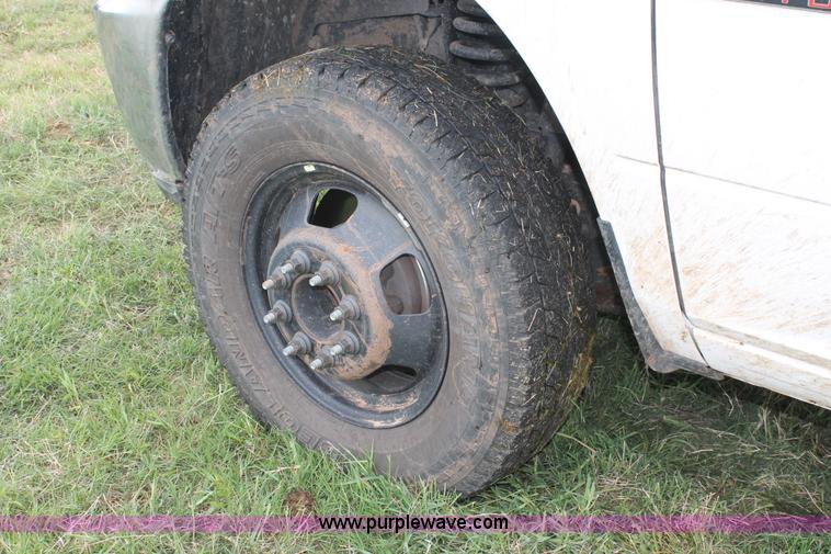 image for item K8913 2014 Dodge Ram 3500HD Quad Cab flatbed pickup truck